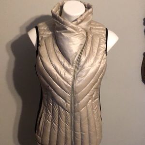 Calvin Kline's performance down vest with stretch side panels.